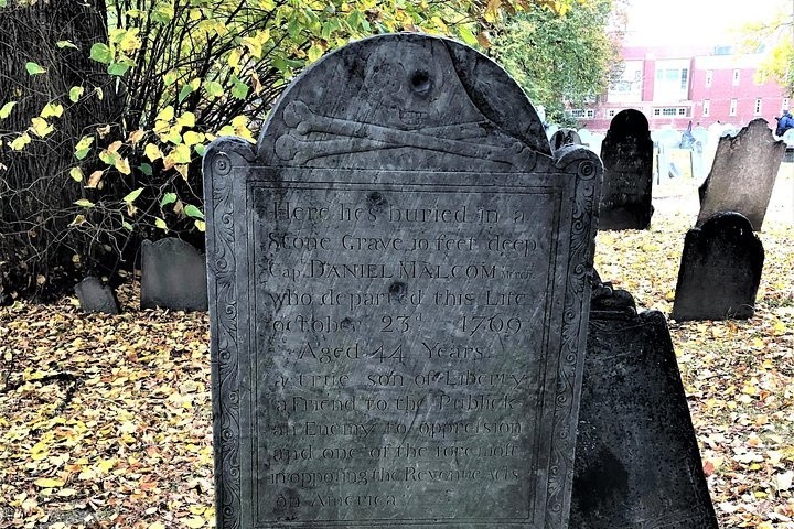 a gravestone in a park